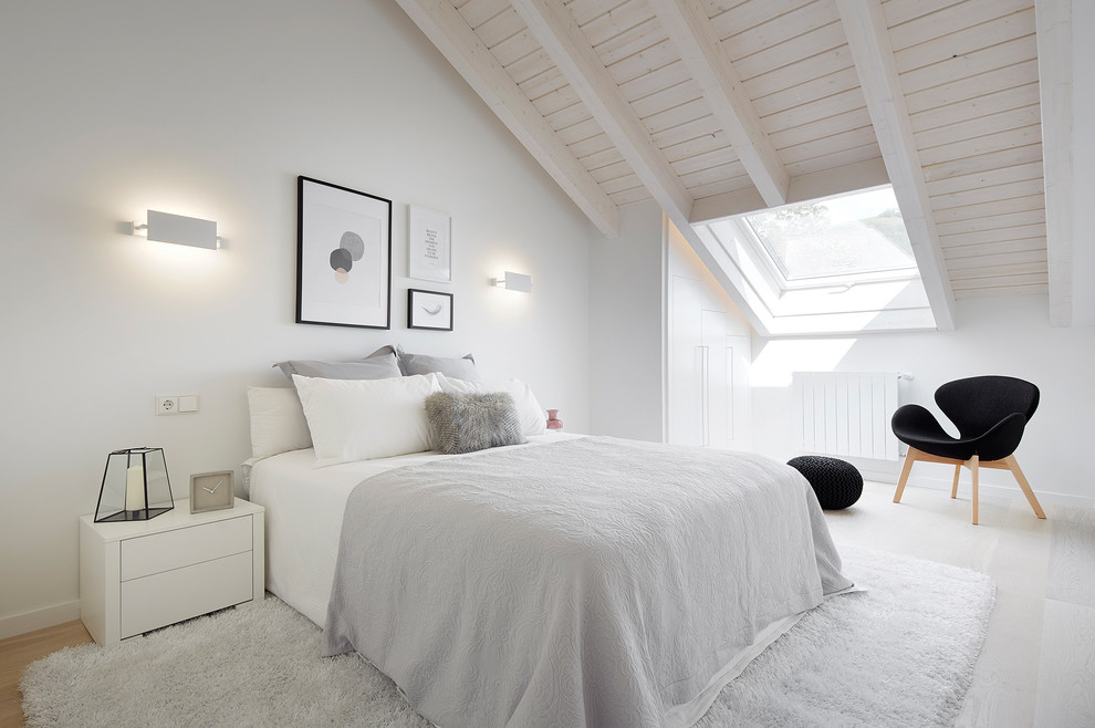 Photo of a mid-sized scandinavian bedroom in Other with white walls and no fireplace.