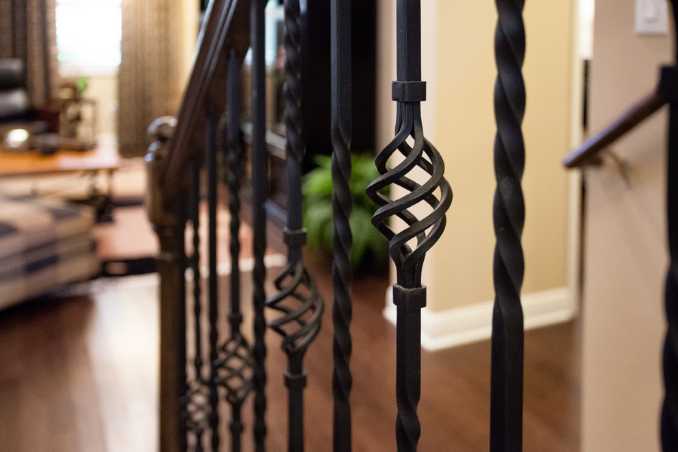Inspiration for a traditional wood u-shaped staircase in Tampa with wood risers.