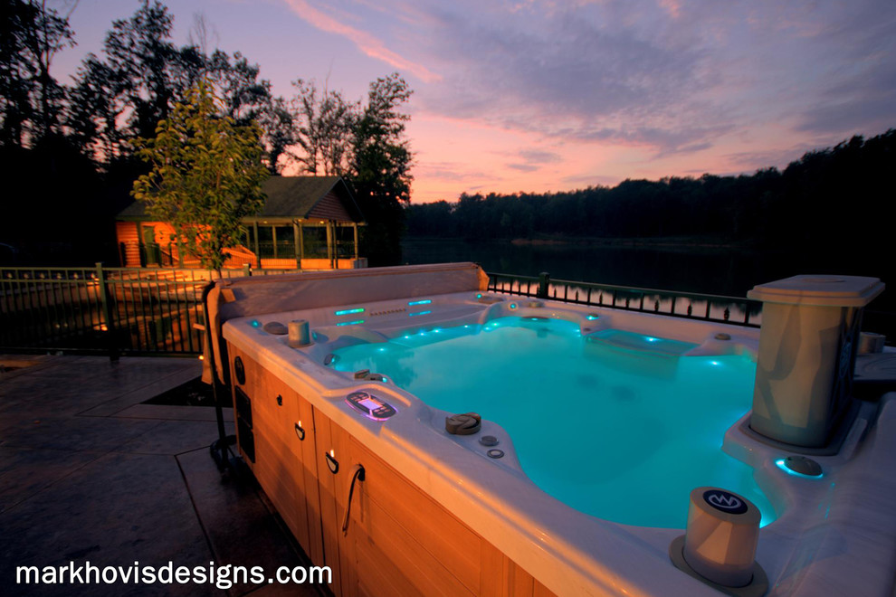 Mountain style front yard wood, stone and rectangular natural hot tub photo