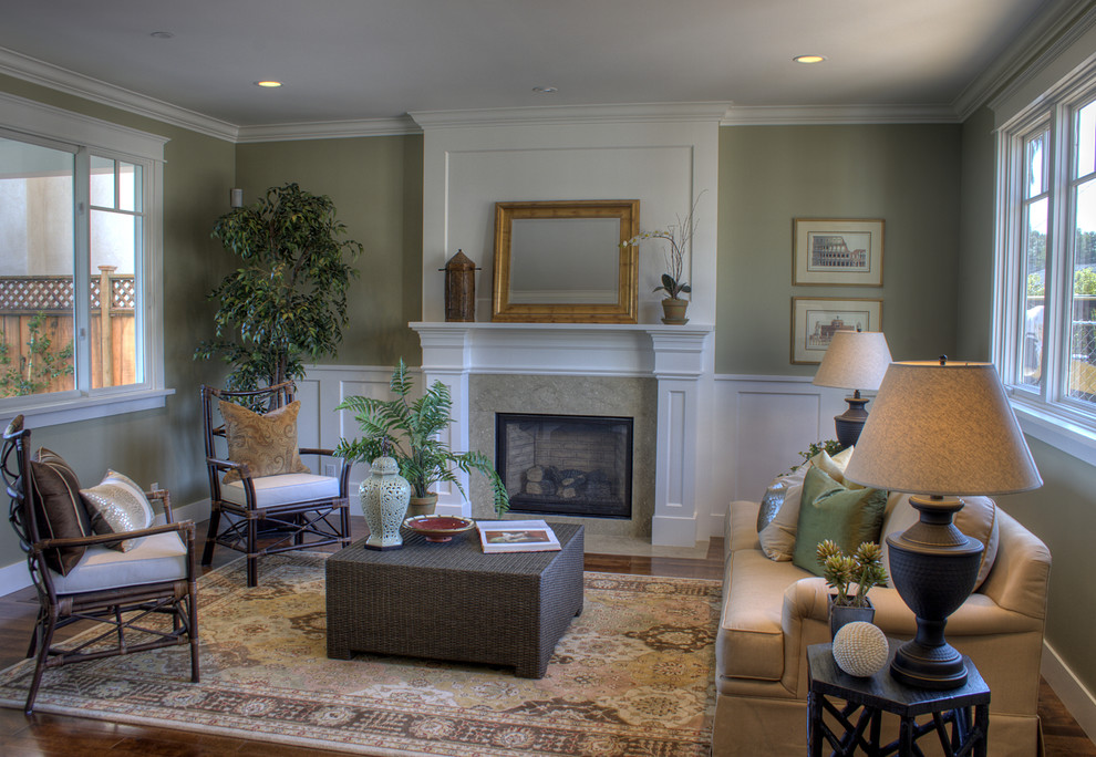 Design ideas for a traditional formal living room in San Francisco with green walls, a standard fireplace and no tv.