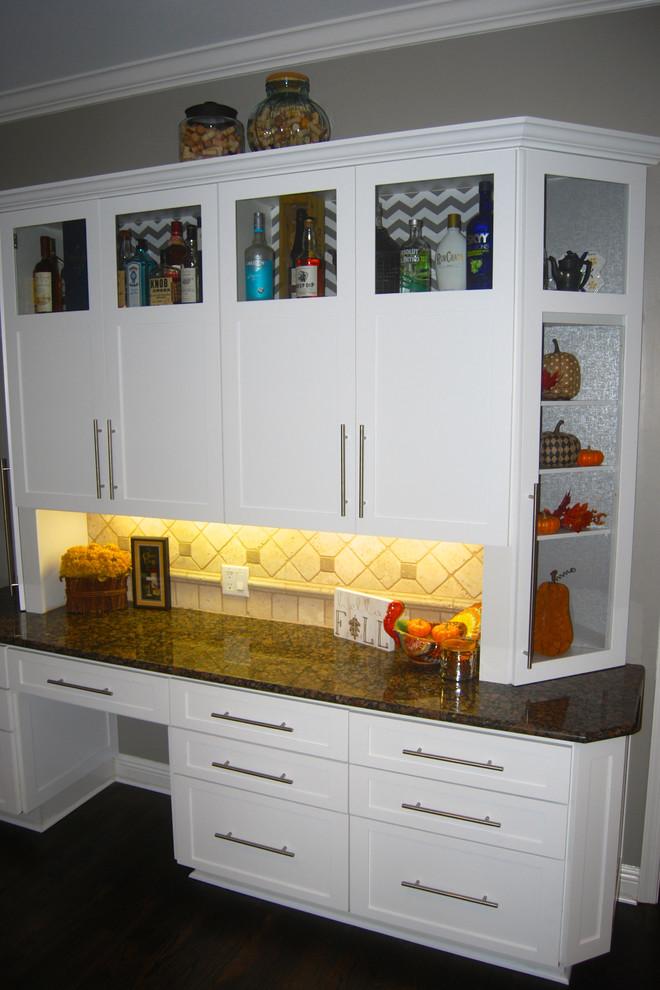 Inspiration for a mid-sized transitional l-shaped enclosed kitchen remodel in Miami with shaker cabinets, white cabinets, granite countertops, beige backsplash, ceramic backsplash and stainless steel appliances