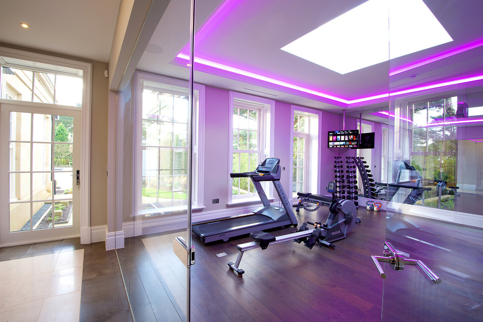 This is an example of a contemporary home gym in Cheshire with medium hardwood floors.