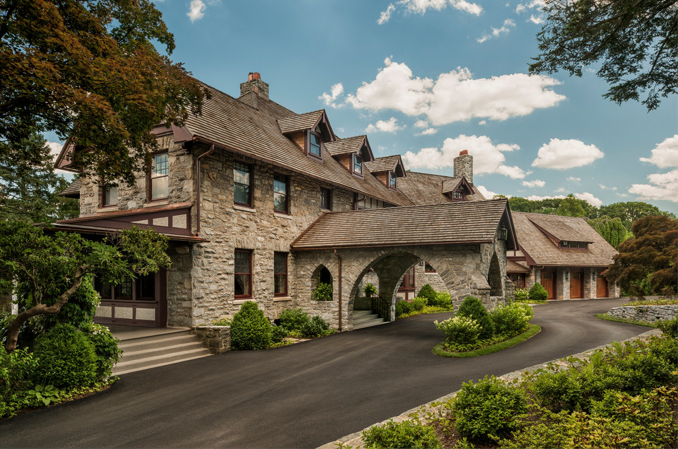 Design ideas for a traditional three-storey exterior in Philadelphia with stone veneer and a gable roof.