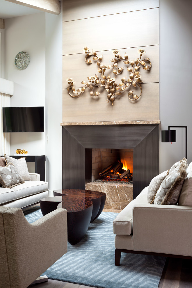 This is an example of a large contemporary formal open concept living room in Denver with white walls, light hardwood floors, a standard fireplace, a metal fireplace surround and a wall-mounted tv.