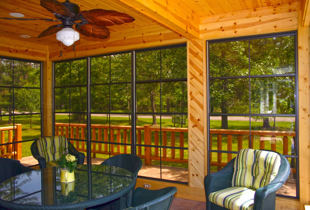 Photo of a mid-sized country sunroom in Philadelphia with dark hardwood floors and a standard ceiling.
