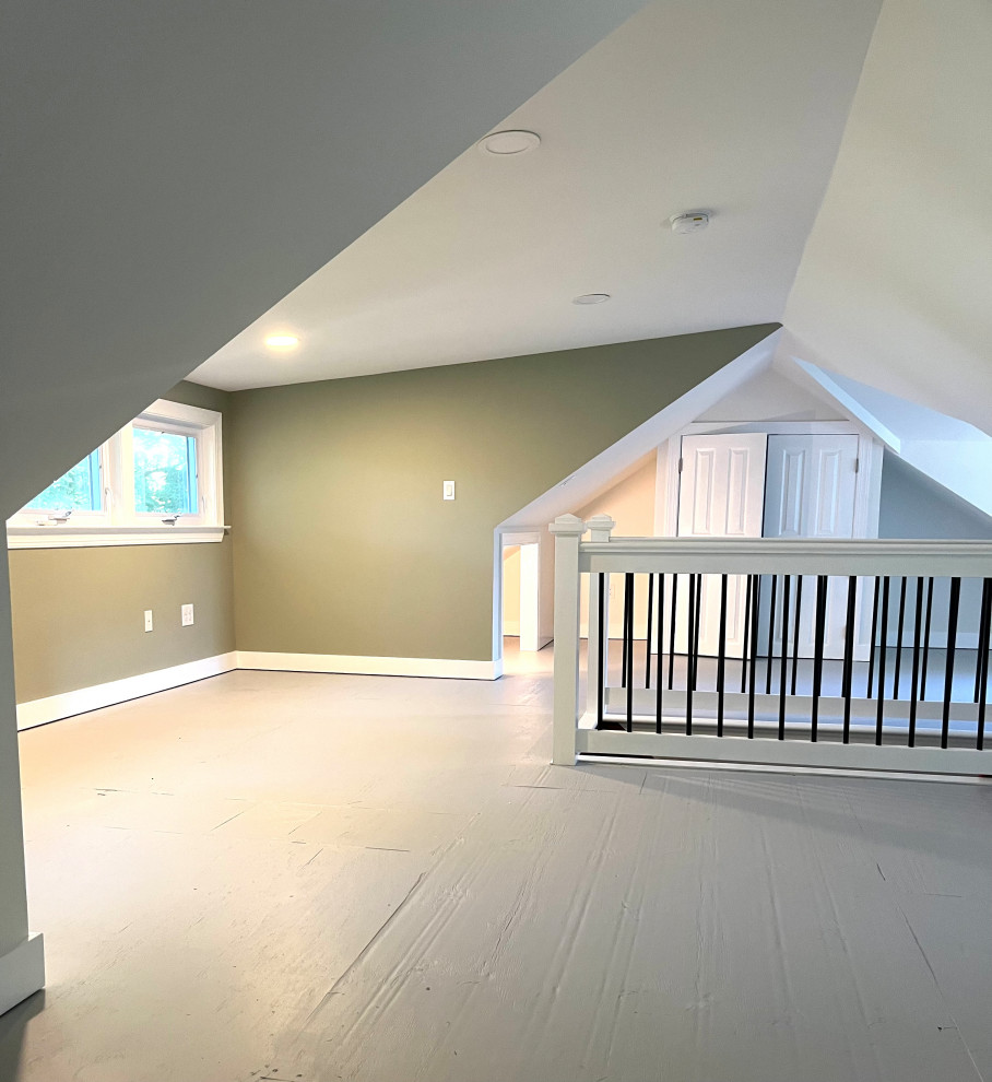 Example of a mid-sized classic plywood floor, gray floor and vaulted ceiling home office design in New York with white walls