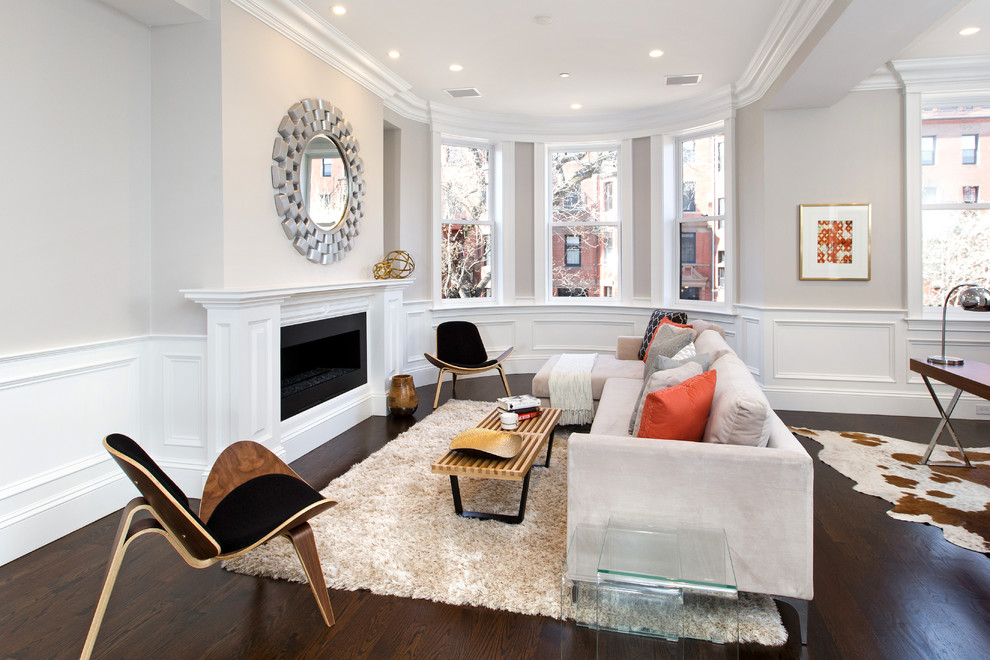 Example of a transitional dark wood floor living room design in Boston with beige walls, a ribbon fireplace and no tv