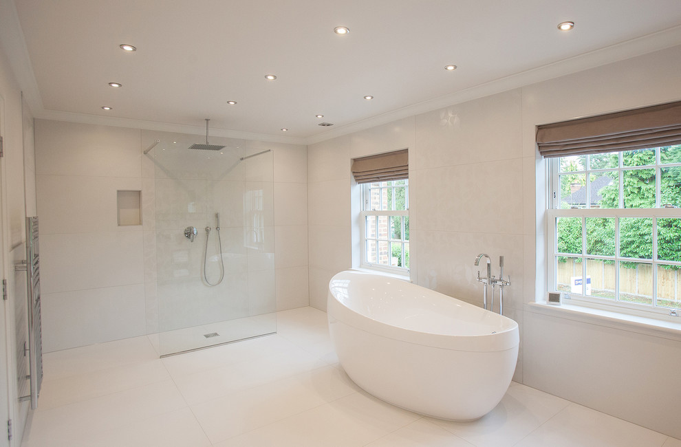 This is an example of a contemporary bathroom in Surrey with a freestanding tub, an open shower and an open shower.