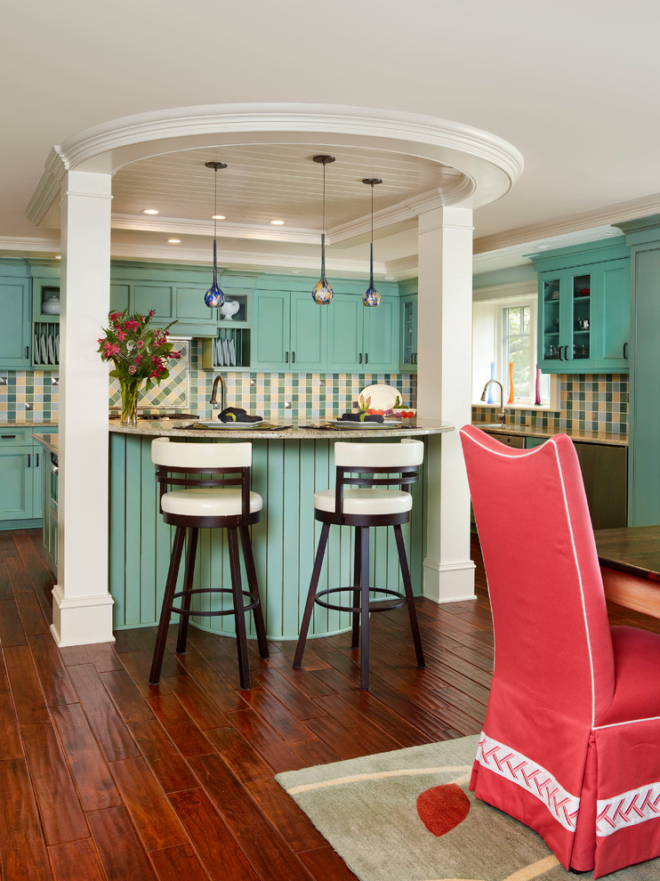 Example of a large transitional u-shaped medium tone wood floor eat-in kitchen design in Charleston with an undermount sink, recessed-panel cabinets, blue cabinets, granite countertops, ceramic backsplash, stainless steel appliances, an island and multicolored backsplash