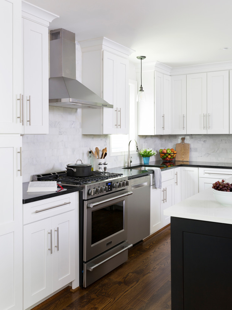 Design ideas for a large transitional l-shaped eat-in kitchen in DC Metro with white cabinets, grey splashback, marble splashback, stainless steel appliances, medium hardwood floors and with island.