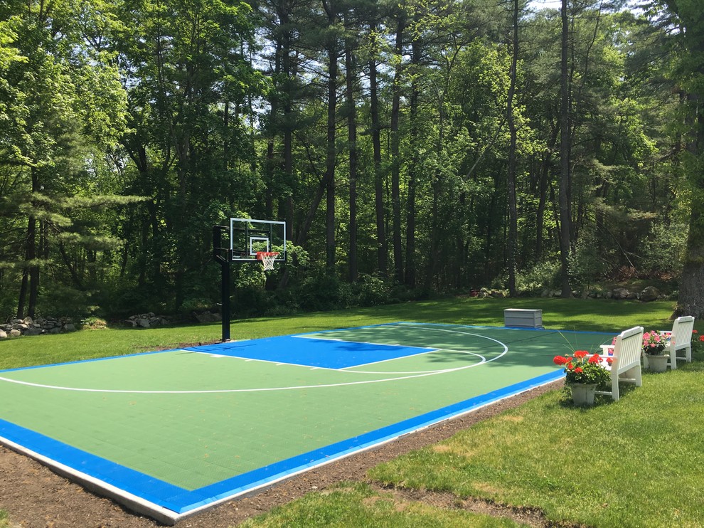 This is an example of a large traditional backyard outdoor sport court in Boston.