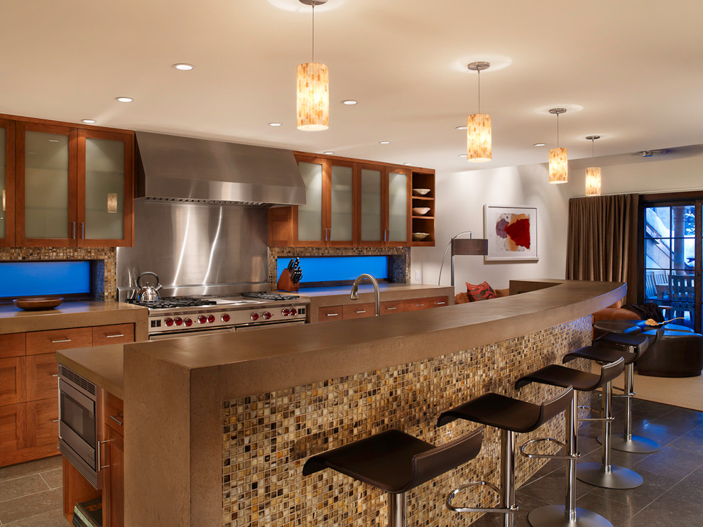 Photo of a contemporary galley kitchen in Denver with stainless steel appliances.