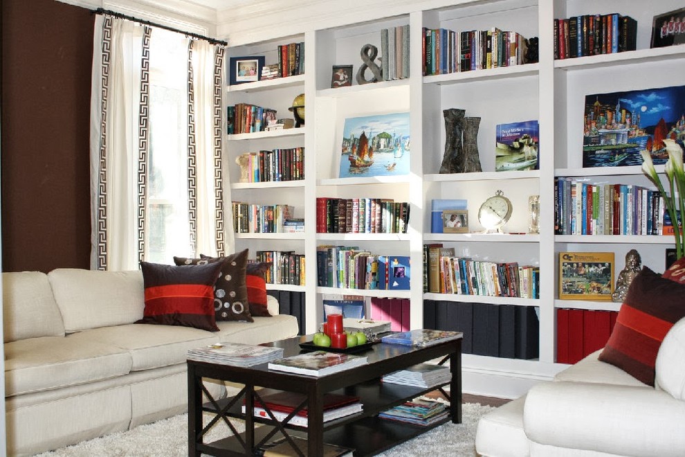 This is an example of a mid-sized transitional living room in Atlanta with a library, brown walls and dark hardwood floors.