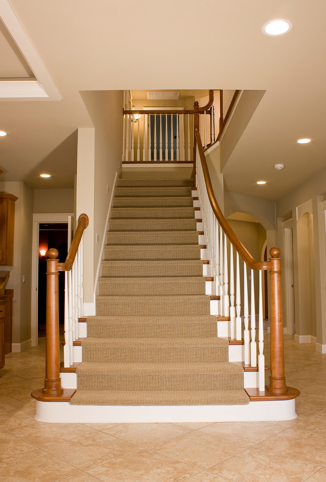 Photo of a mid-sized traditional carpeted straight staircase in Seattle with wood risers.