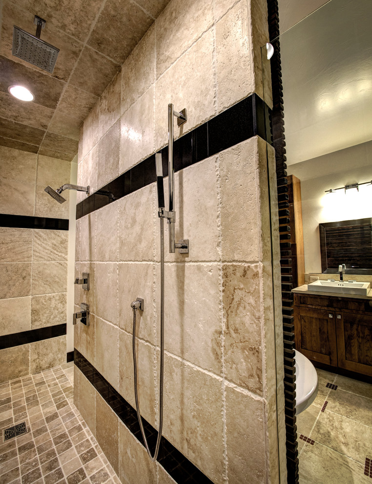 Design ideas for a large contemporary master bathroom in Other with a drop-in sink, shaker cabinets, medium wood cabinets, a freestanding tub, a curbless shower, multi-coloured tile, stone tile, beige walls and travertine floors.