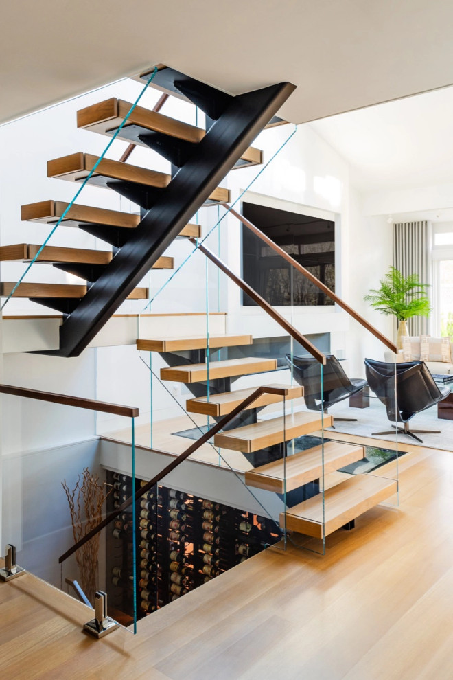 This is an example of a contemporary wood floating staircase in Boston.