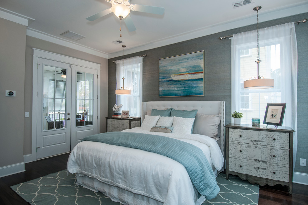 This is an example of a contemporary bedroom in Charleston with dark hardwood floors and grey walls.