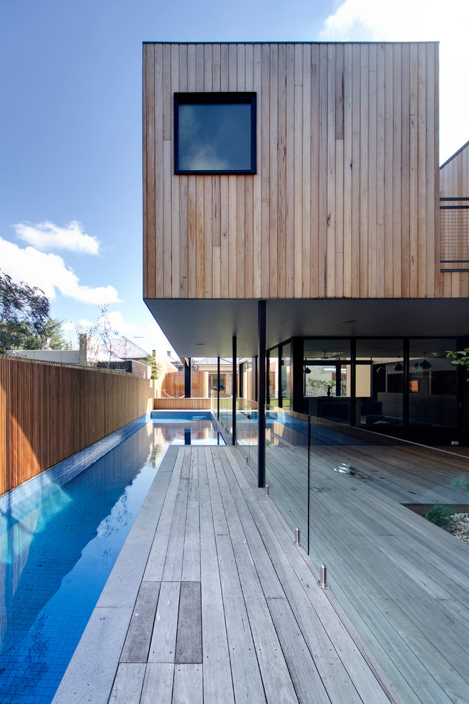 Design ideas for a modern backyard lap pool in Melbourne.