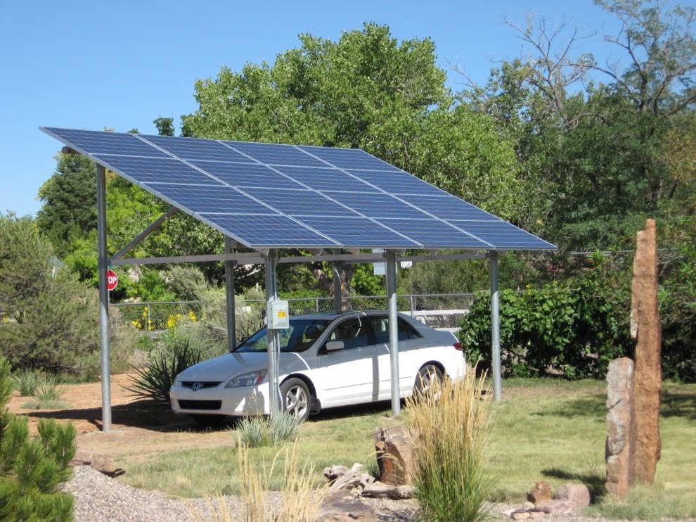 This is an example of a mid-sized modern detached one-car carport in Albuquerque.