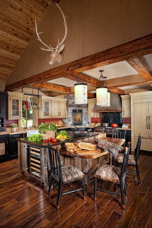 Eat-in kitchen - mid-sized rustic l-shaped dark wood floor eat-in kitchen idea with recessed-panel cabinets, red backsplash, colored appliances and an island