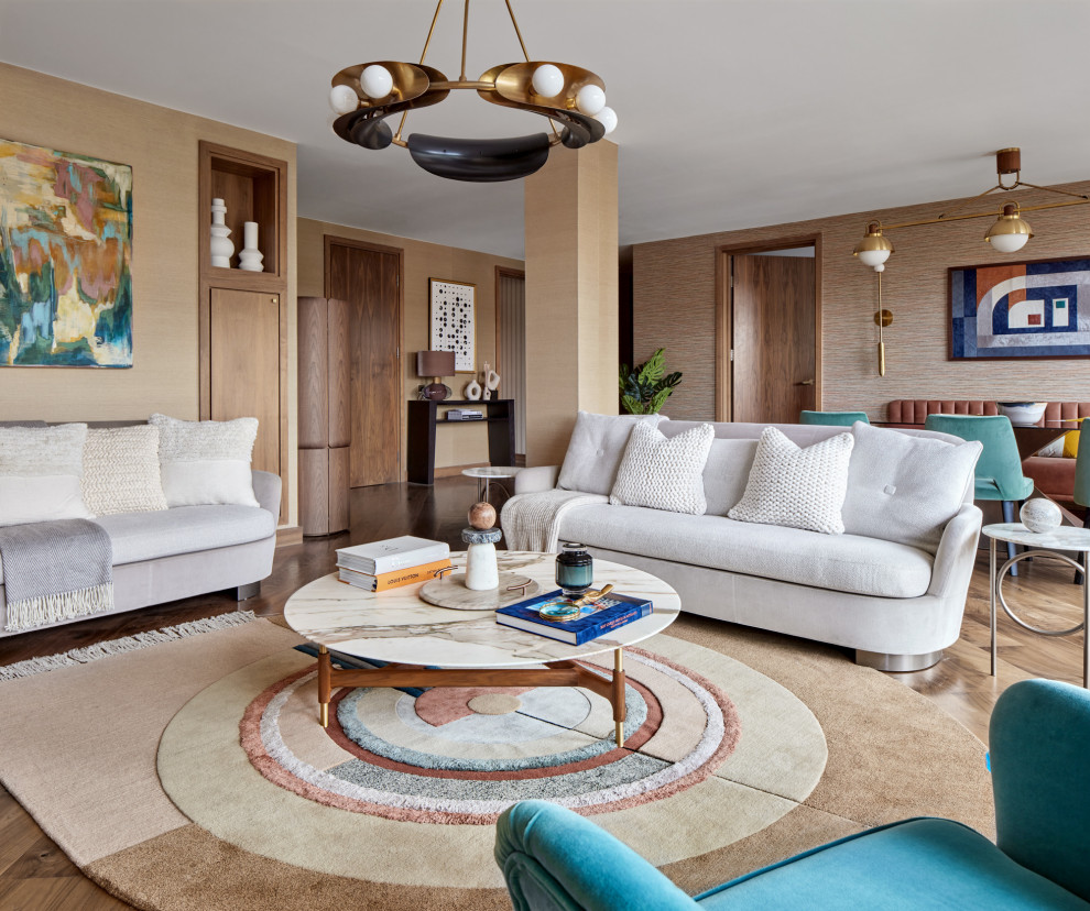 Medium sized midcentury open plan living room in London with medium hardwood flooring and brown floors.