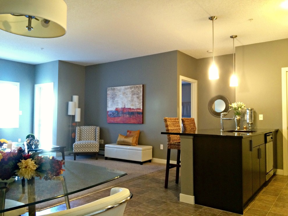 Example of a transitional home design design in Calgary