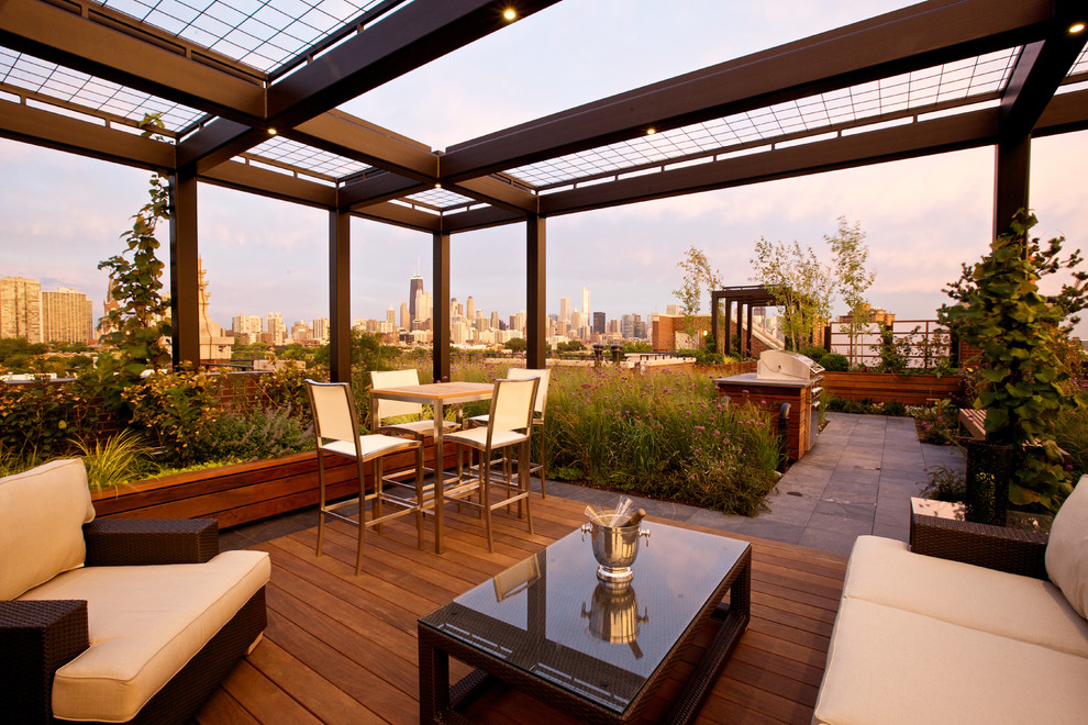 This is an example of a large contemporary rooftop and rooftop deck in Chicago with a pergola.