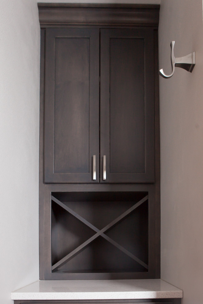 Example of a transitional master gray tile ceramic tile alcove bathtub design with recessed-panel cabinets, dark wood cabinets, gray walls, an undermount sink and quartz countertops