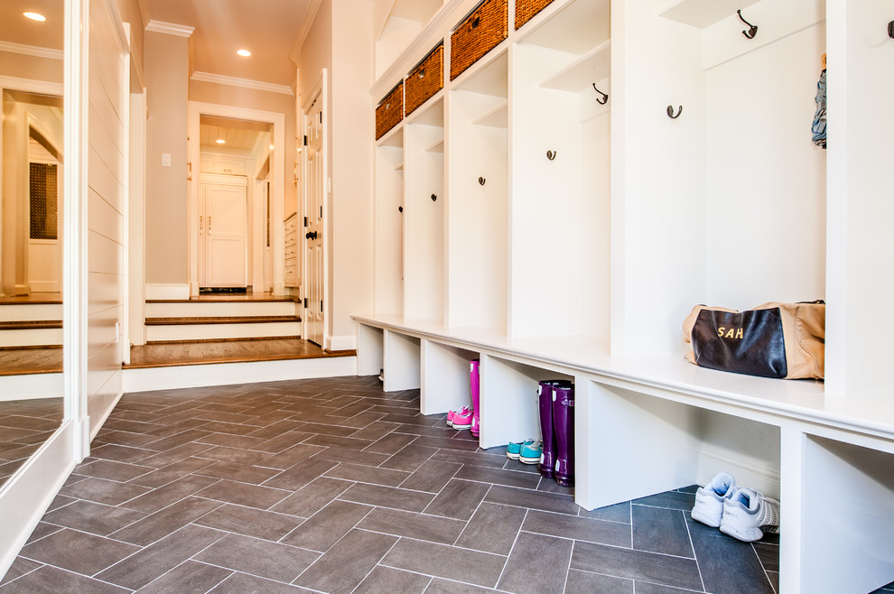 This is an example of a mid-sized traditional mudroom in DC Metro with beige walls, porcelain floors, a single front door and a white front door.