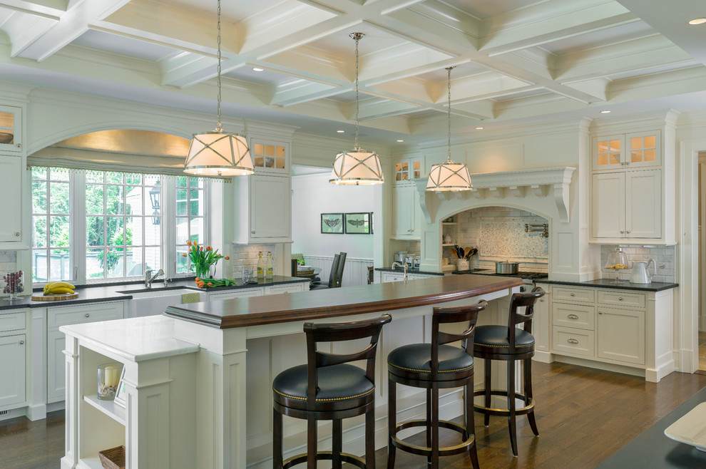 Design ideas for a large traditional kitchen in Boston with white cabinets and with island.