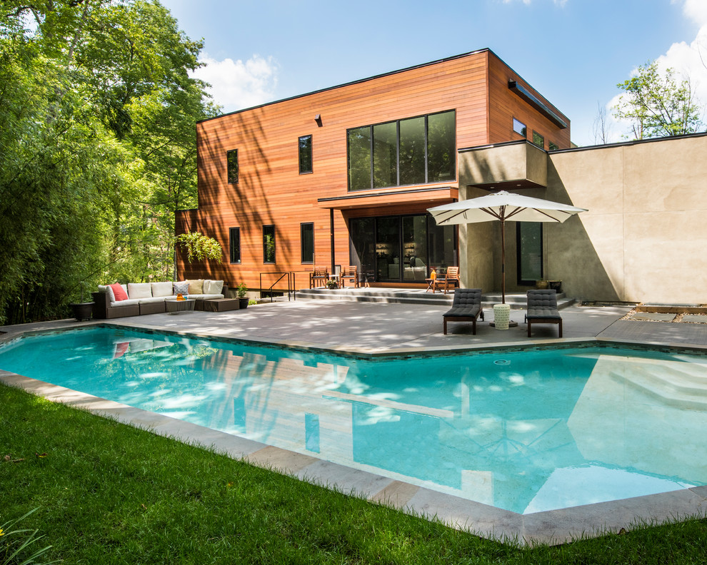 Design ideas for a contemporary backyard custom-shaped pool in DC Metro.