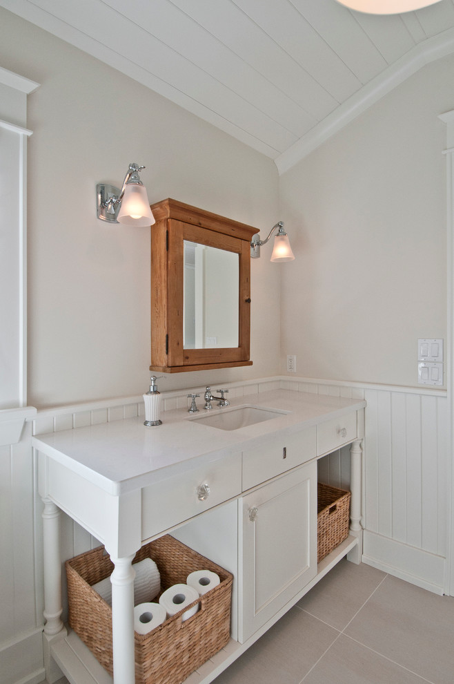 Mid-sized beach style kids bathroom in Toronto with an undermount sink, shaker cabinets, white cabinets, engineered quartz benchtops, an alcove shower, white walls and porcelain floors.