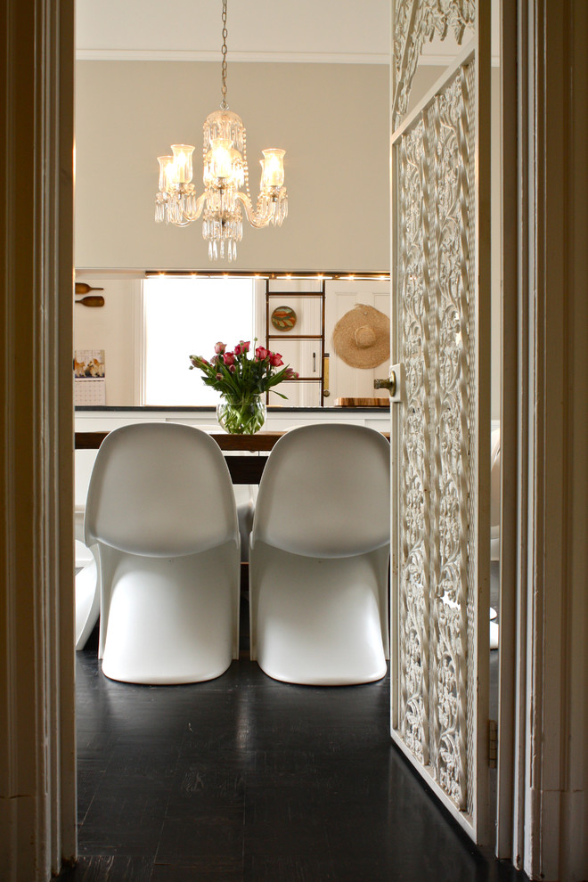 Inspiration for an eclectic dining room in San Francisco with white walls.