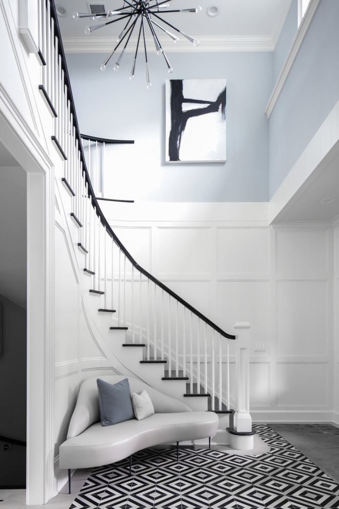This is an example of a mid-sized transitional wood curved staircase in New York with wood risers and wood railing.