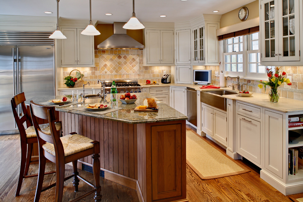 Inspiration for a country kitchen in Newark with glass-front cabinets and granite benchtops.