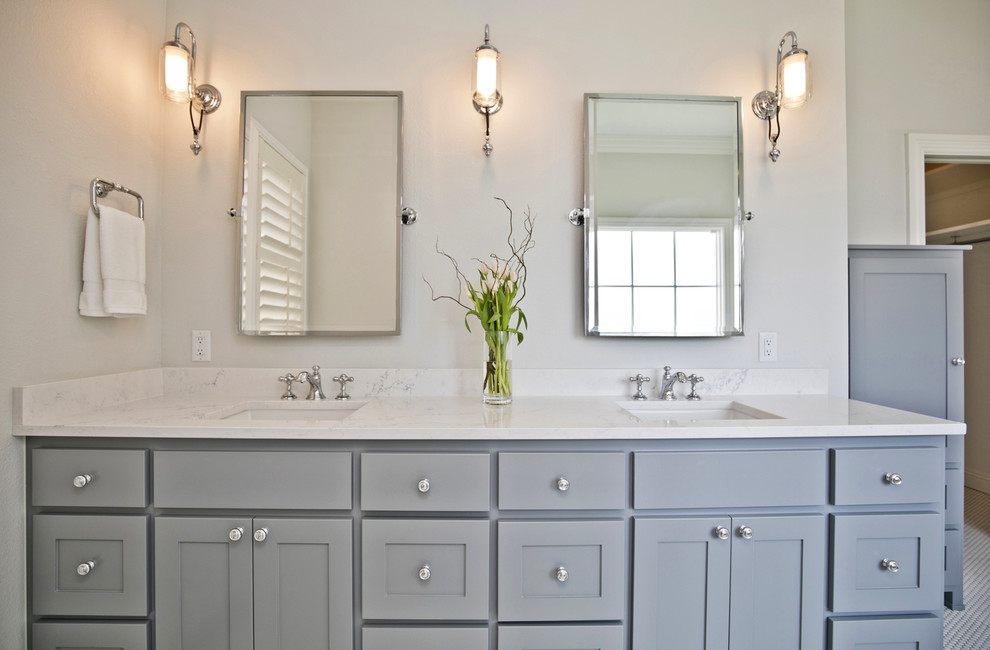 This is an example of a mid-sized transitional master bathroom in Other with shaker cabinets, grey cabinets, a claw-foot tub, an alcove shower, white tile, subway tile, grey walls, porcelain floors, an undermount sink, marble benchtops, white floor, a hinged shower door and white benchtops.