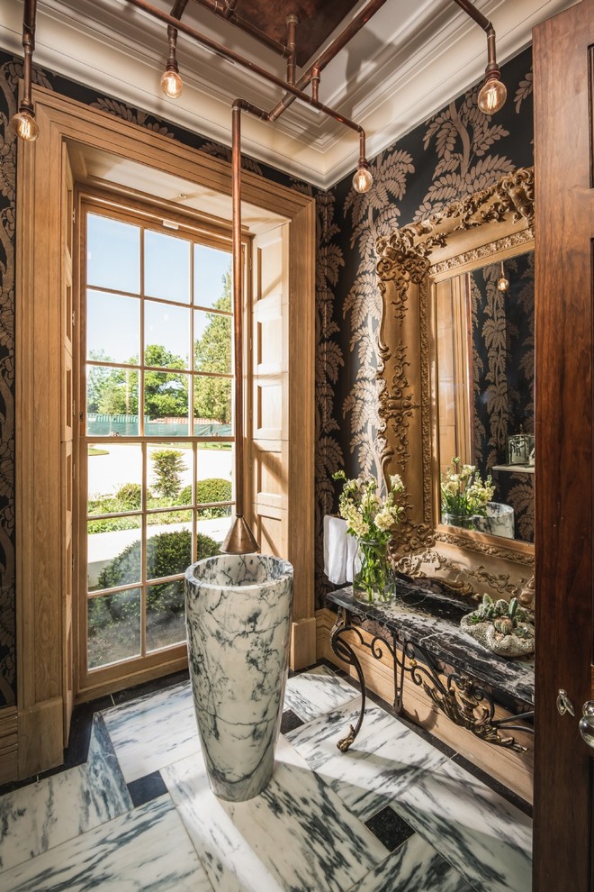 Design ideas for an eclectic powder room in Surrey with multi-coloured walls, marble floors, a pedestal sink, marble benchtops and white floor.