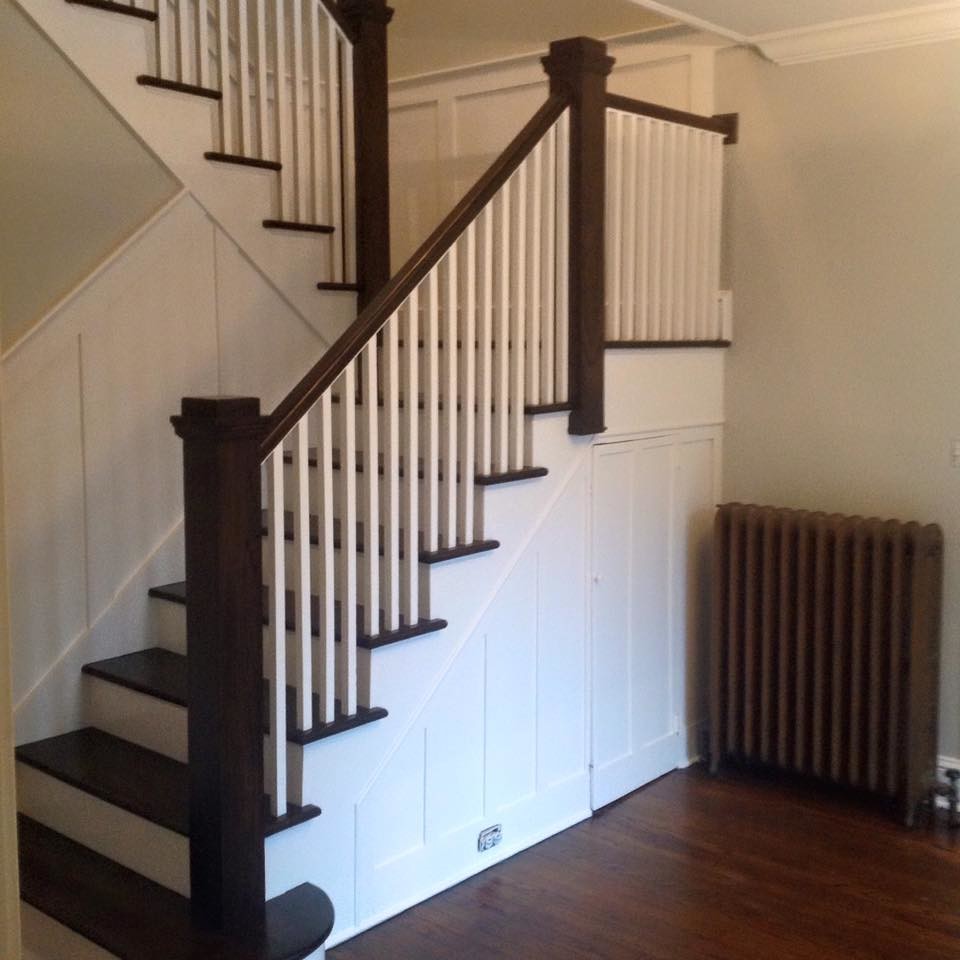 Inspiration for a mid-sized arts and crafts wood l-shaped staircase in New York with painted wood risers.