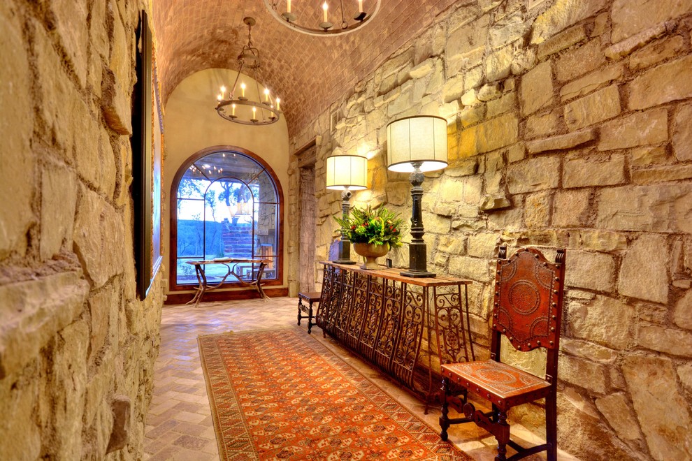 Example of a mountain style foyer design in Austin with a medium wood front door