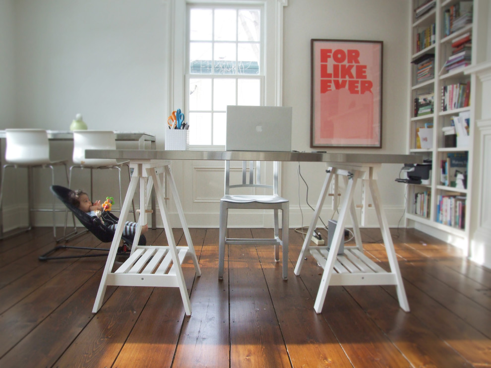 Inspiration for an eclectic home office in Bridgeport with white walls, dark hardwood floors and a freestanding desk.
