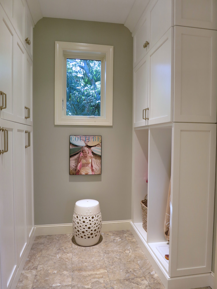 Design ideas for an expansive utility room in Atlanta with an undermount sink, shaker cabinets, white cabinets, quartz benchtops, green walls, ceramic floors and a side-by-side washer and dryer.