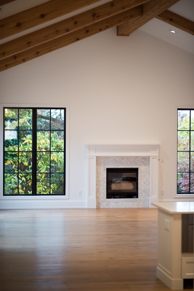 Inspiration for a mid-sized transitional u-shaped medium tone wood floor eat-in kitchen remodel in Seattle with a double-bowl sink, raised-panel cabinets, white cabinets, soapstone countertops, white backsplash, stone slab backsplash, stainless steel appliances and an island