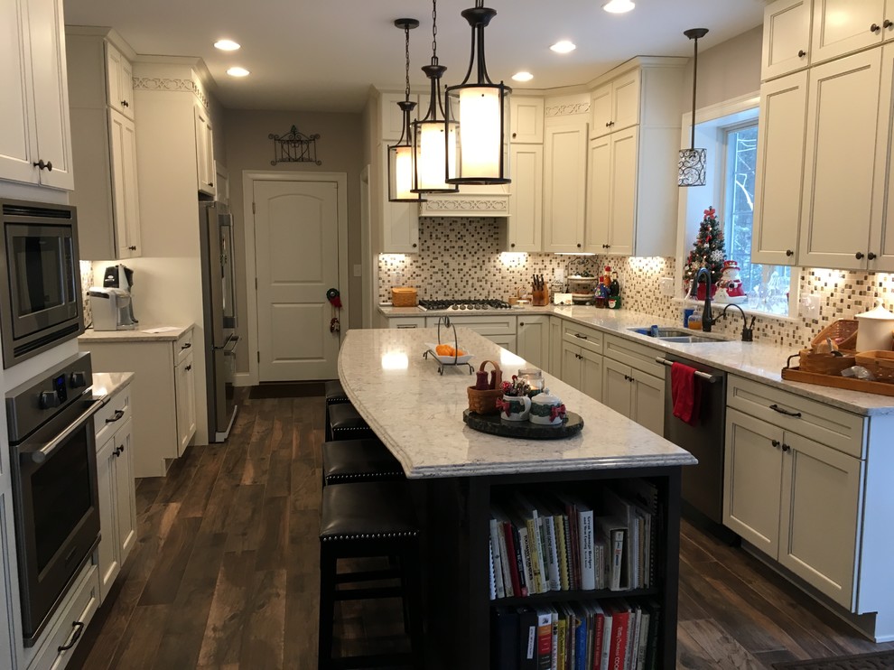 Traditional kitchen in Boston with quartz benchtops.