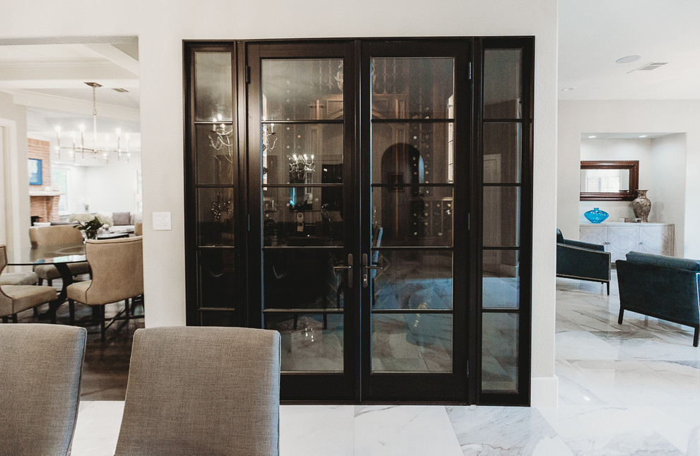 Inspiration for a large contemporary wine cellar in Austin with marble floors, storage racks and white floor.