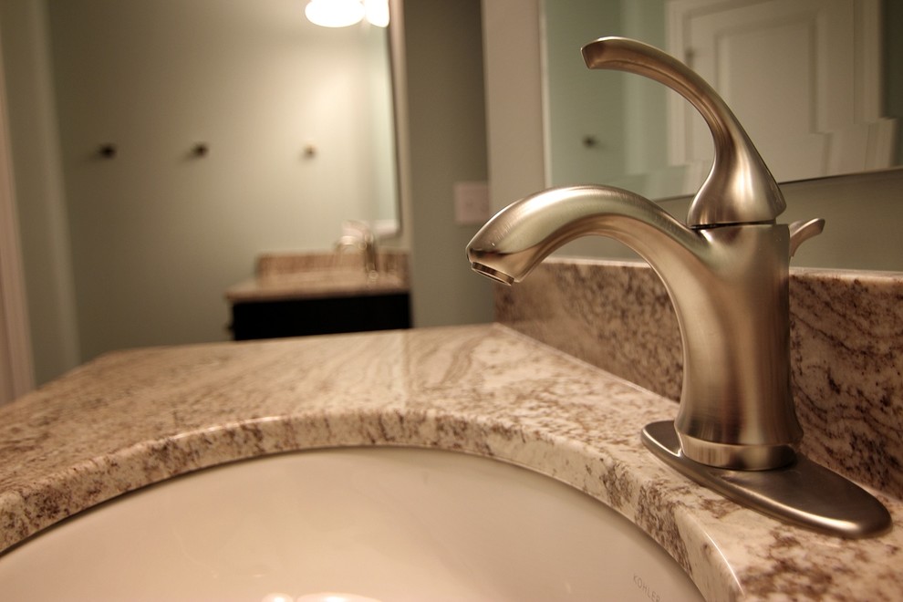 Mid-sized transitional master multicolored tile and matchstick tile bathroom photo in Chicago with flat-panel cabinets, dark wood cabinets, beige walls, an undermount sink and granite countertops