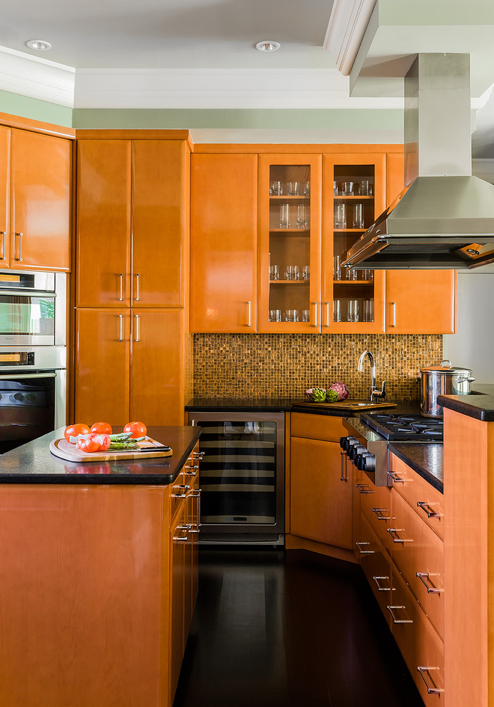 Photo of a contemporary kitchen in Boston with flat-panel cabinets and medium wood cabinets.