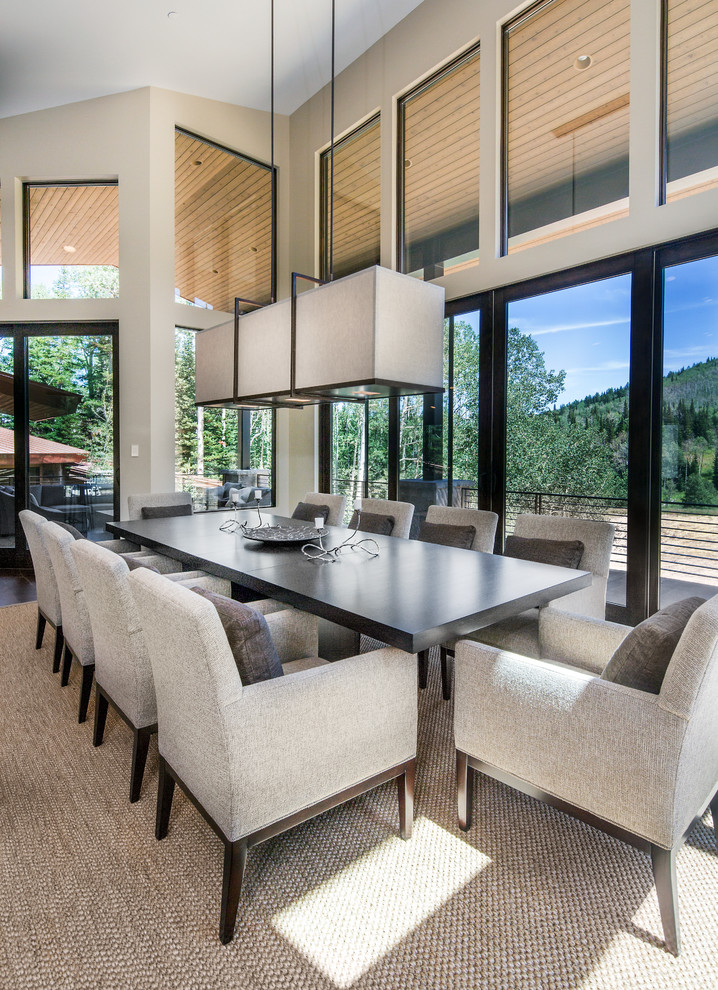 Large contemporary dining room in Salt Lake City with beige walls and carpet.