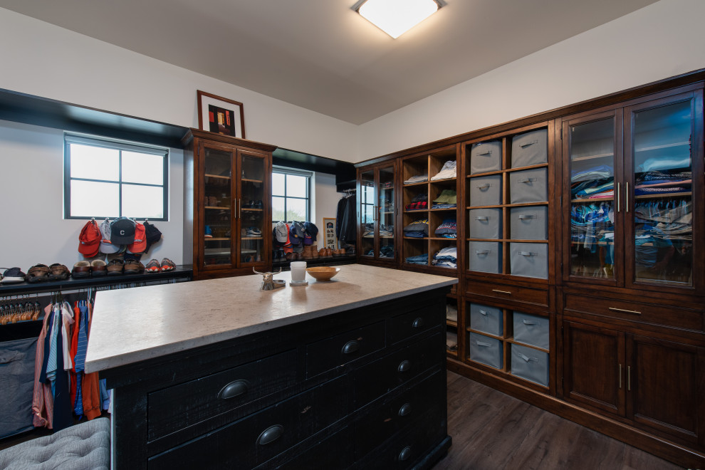 Inspiration for a large eclectic gender-neutral laminate floor and gray floor walk-in closet remodel in Other with flat-panel cabinets and medium tone wood cabinets