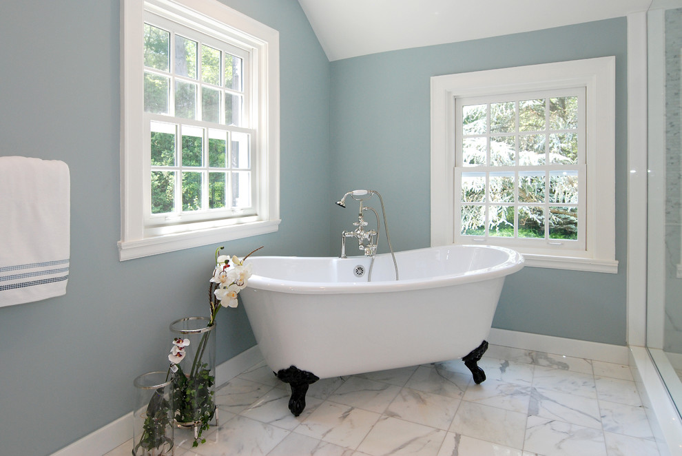 Design ideas for a contemporary bathroom in New York with a claw-foot tub.