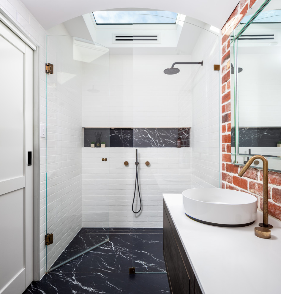 Industrial bathroom in Perth with a claw-foot tub, engineered quartz benchtops, white benchtops, flat-panel cabinets, dark wood cabinets, white tile, subway tile, a vessel sink, a niche, a single vanity and a floating vanity.